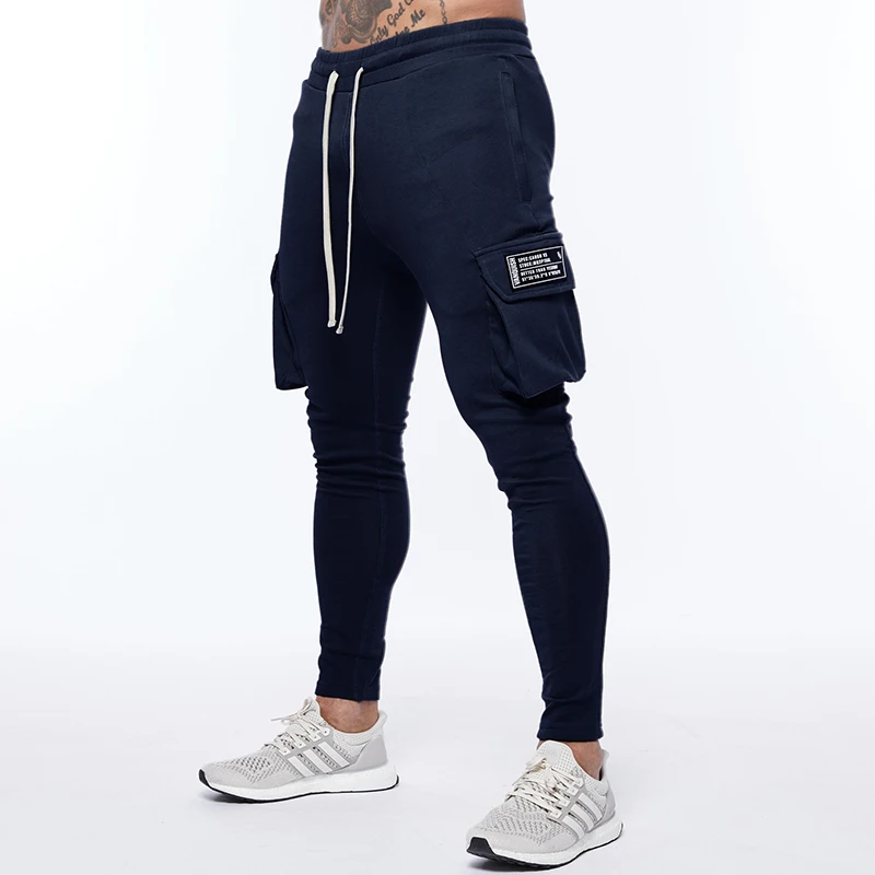 Rudens Jaunās Vīriešu Skriešanas Treniņbikses Kokvilnas Kabatas Dizaina Darbojas Kravu Sporta Bikses Vīriešu Fitness Multi-Pocket-Style Apmācību Tērps
